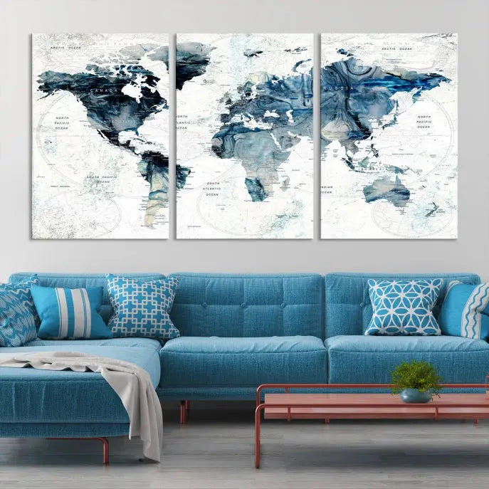 The Watercolor World Map Wall Art Canvas Print, a three-panel abstract masterpiece on museum-quality canvases, adorns the wall.