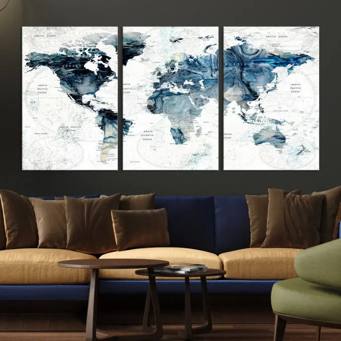 The Watercolor World Map Wall Art Canvas Print, a three-panel abstract masterpiece on museum-quality canvases, adorns the wall.