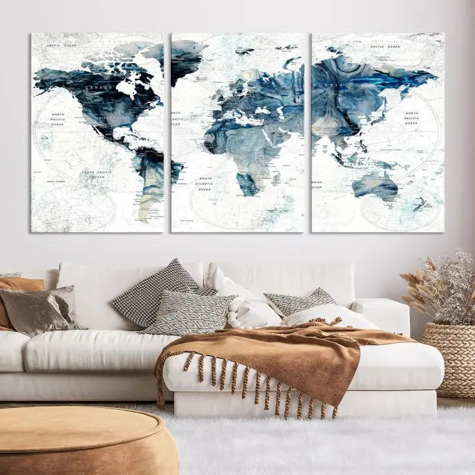 The Watercolor World Map Wall Art Canvas Print, a three-panel abstract masterpiece on museum-quality canvases, adorns the wall.