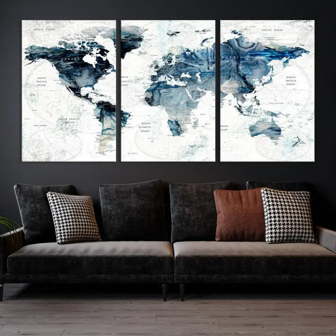 The Watercolor World Map Wall Art Canvas Print, a three-panel abstract masterpiece on museum-quality canvases, adorns the wall.