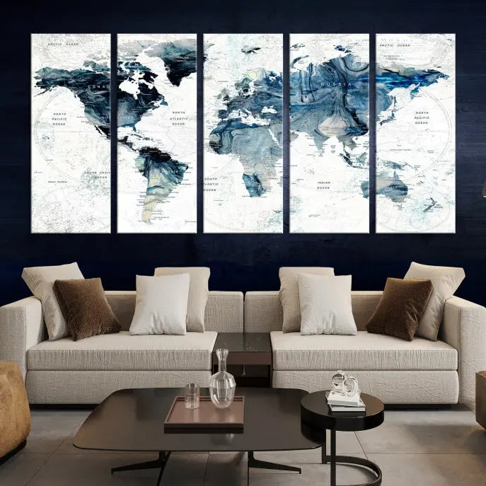 The Watercolor World Map Wall Art Canvas Print, a three-panel abstract masterpiece on museum-quality canvases, adorns the wall.