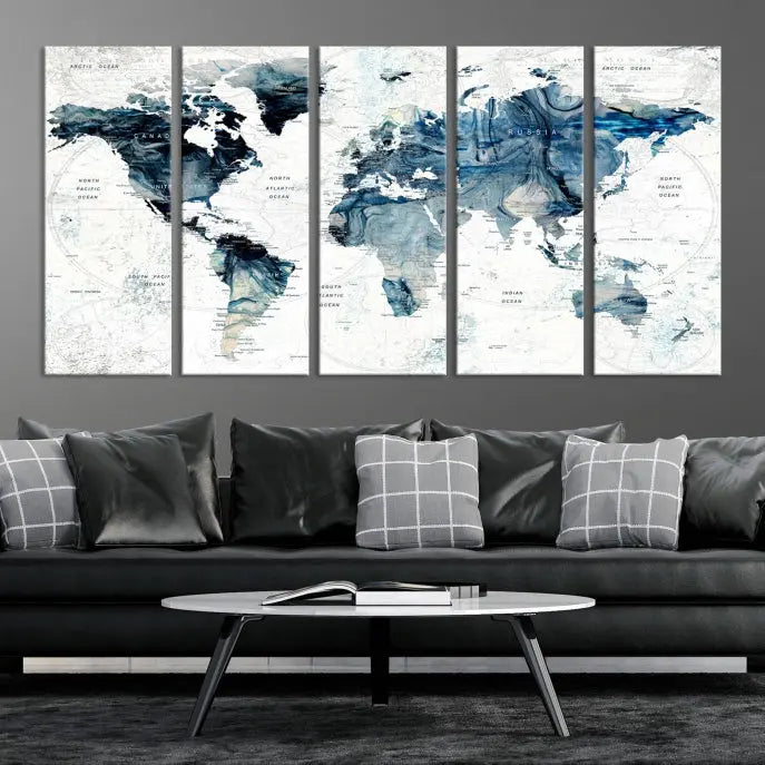 The Watercolor World Map Wall Art Canvas Print, a three-panel abstract masterpiece on museum-quality canvases, adorns the wall.