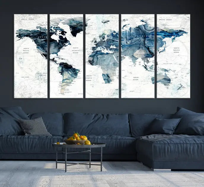 The Watercolor World Map Wall Art Canvas Print, a three-panel abstract masterpiece on museum-quality canvases, adorns the wall.