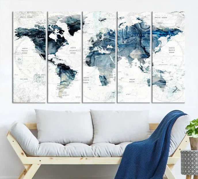 The Watercolor World Map Wall Art Canvas Print, a three-panel abstract masterpiece on museum-quality canvases, adorns the wall.