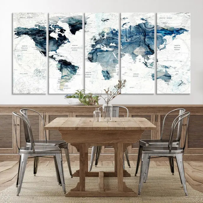 The Watercolor World Map Wall Art Canvas Print, a three-panel abstract masterpiece on museum-quality canvases, adorns the wall.