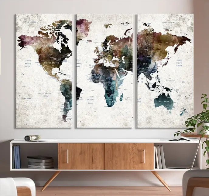 A gallery-wrapped Watercolor World Map Wall Art Canvas Print adorns the wall, printed on museum-quality canvas and finished with a UV-protective coating to preserve its vibrant hues.