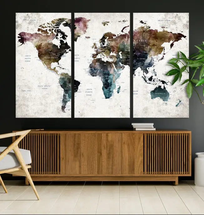 A gallery-wrapped Watercolor World Map Wall Art Canvas Print adorns the wall, printed on museum-quality canvas and finished with a UV-protective coating to preserve its vibrant hues.