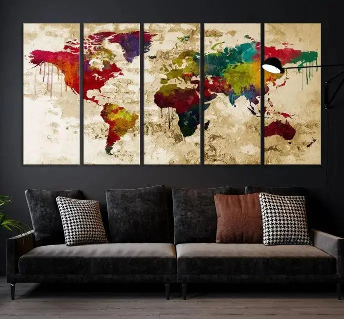 The modern living room features the Watercolor World Map Wall Art Canvas Print adorning the wall. The museum-quality canvas ensures every detail pops and is expertly crafted by professional craftsmen for a polished look that's ready to hang.