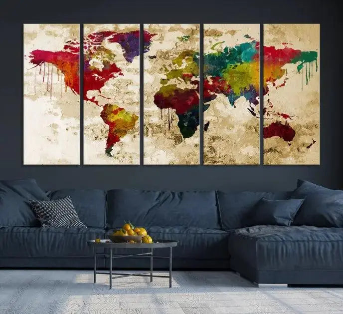 The modern living room features the Watercolor World Map Wall Art Canvas Print adorning the wall. The museum-quality canvas ensures every detail pops and is expertly crafted by professional craftsmen for a polished look that's ready to hang.