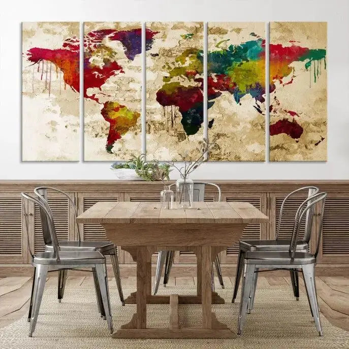 The modern living room features the Watercolor World Map Wall Art Canvas Print adorning the wall. The museum-quality canvas ensures every detail pops and is expertly crafted by professional craftsmen for a polished look that's ready to hang.