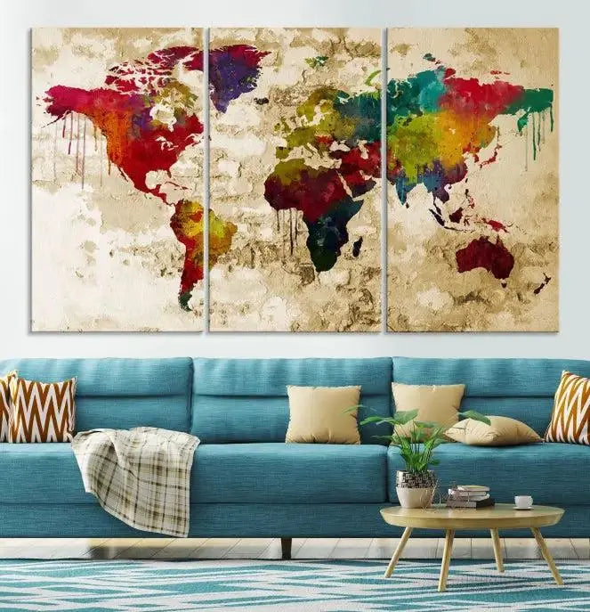 The modern living room features the Watercolor World Map Wall Art Canvas Print adorning the wall. The museum-quality canvas ensures every detail pops and is expertly crafted by professional craftsmen for a polished look that's ready to hang.
