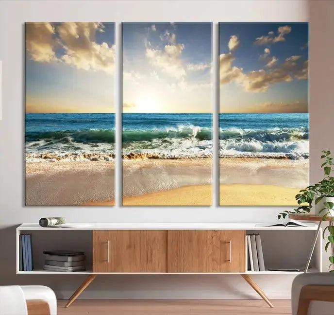 The living room is elevated by museum-quality canvas artwork on the wall: the "Wave on the Beach Wall Art Canvas Print" depicting a beach scene triptych.