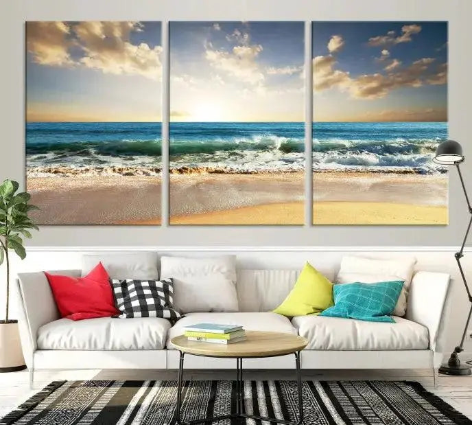 The living room is elevated by museum-quality canvas artwork on the wall: the "Wave on the Beach Wall Art Canvas Print" depicting a beach scene triptych.