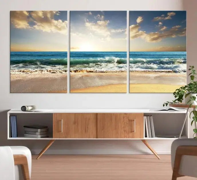 The living room is elevated by museum-quality canvas artwork on the wall: the "Wave on the Beach Wall Art Canvas Print" depicting a beach scene triptych.