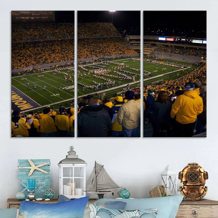 The living room is adorned with the West Virginia Uni Mountaineers Football Team Print, showcasing a captivating scene at Milan Puskar Stadium. This museum-quality, high-resolution canvas print adds a dynamic touch to the space.