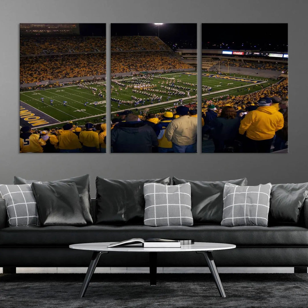 The living room is adorned with the West Virginia Uni Mountaineers Football Team Print, showcasing a captivating scene at Milan Puskar Stadium. This museum-quality, high-resolution canvas print adds a dynamic touch to the space.