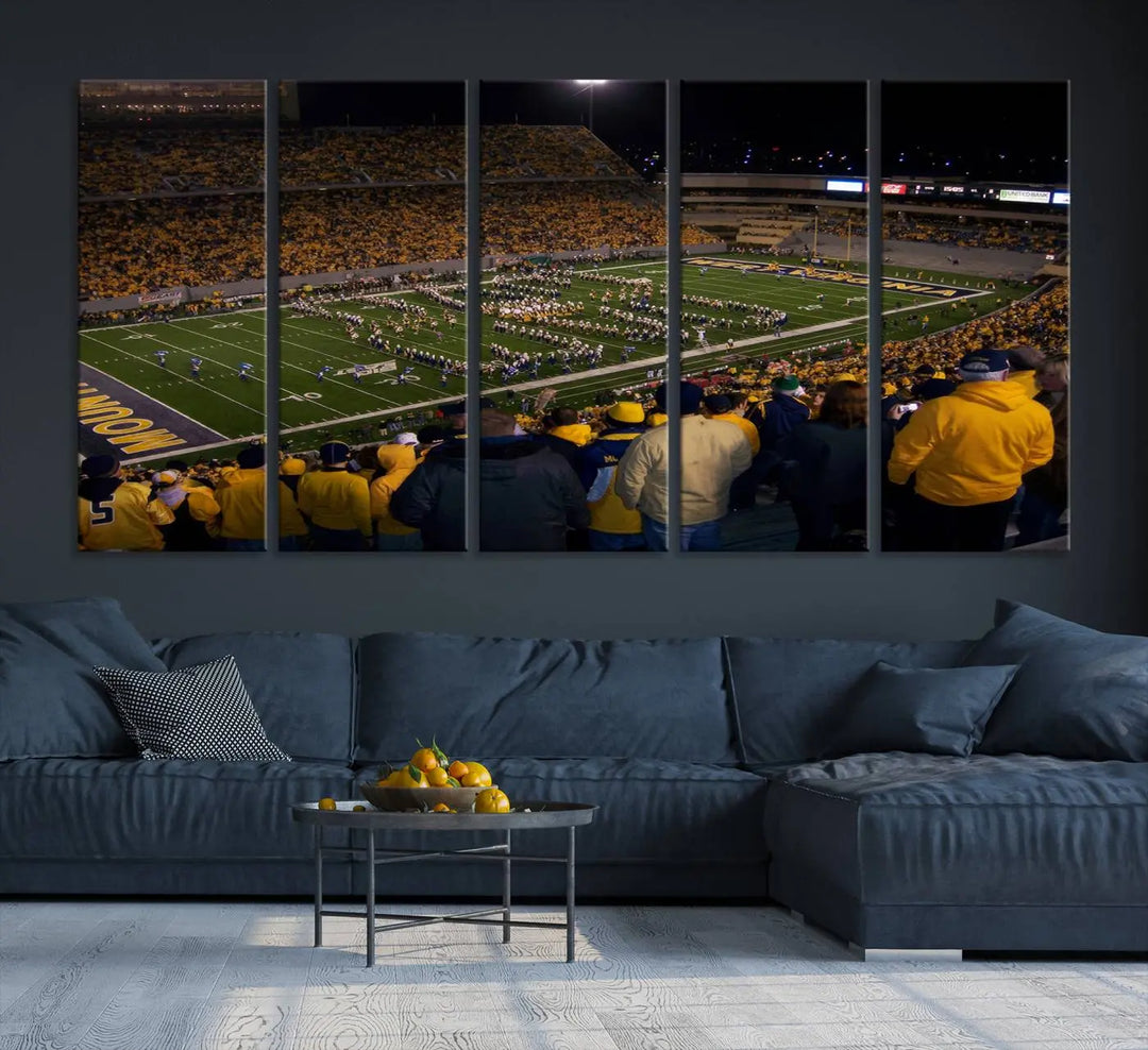 The living room is adorned with the West Virginia Uni Mountaineers Football Team Print, showcasing a captivating scene at Milan Puskar Stadium. This museum-quality, high-resolution canvas print adds a dynamic touch to the space.