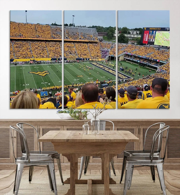 The "West Virginia University Mountaineers Football Team Print" on museum-quality canvas from Morgantown beautifully captures a panoramic view of Milan Puskar Stadium with fans in yellow, fully immersed in the game.