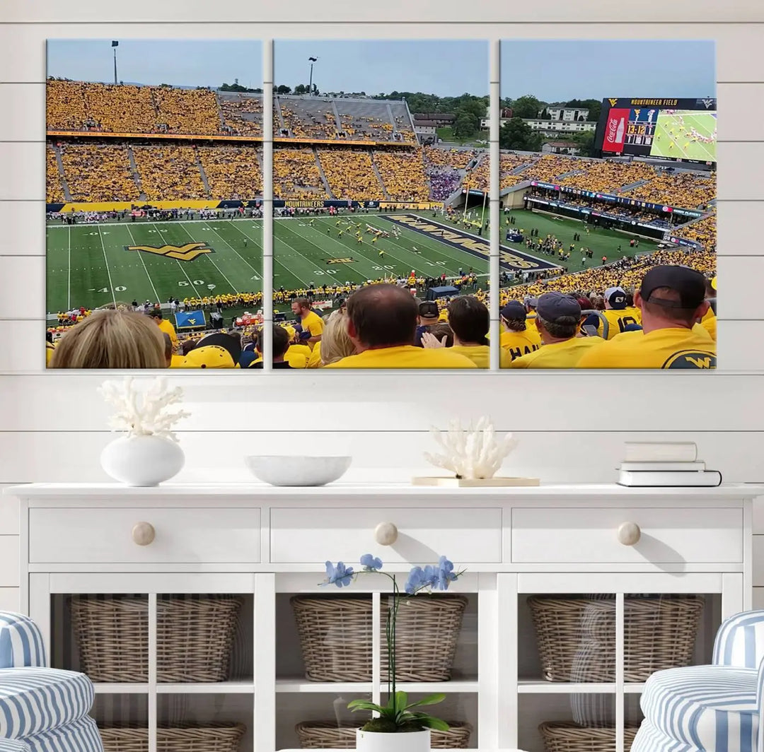 The "West Virginia University Mountaineers Football Team Print" on museum-quality canvas from Morgantown beautifully captures a panoramic view of Milan Puskar Stadium with fans in yellow, fully immersed in the game.