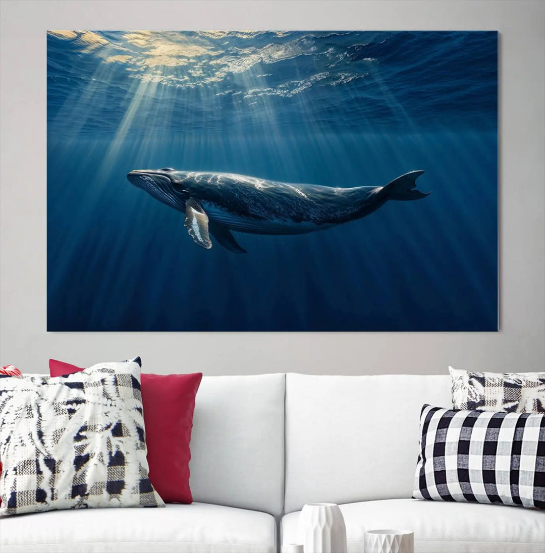 The Whale under Ocean Wall Art Canvas Print adorns the living room wall, capturing a sunlit ocean scene with a gallery-quality finish.