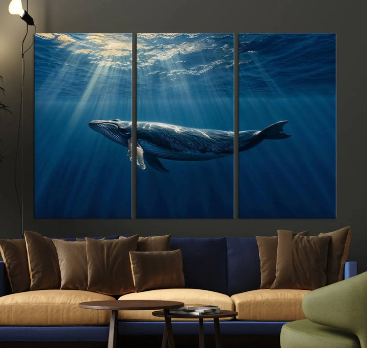 The Whale under Ocean Wall Art Canvas Print adorns the living room wall, capturing a sunlit ocean scene with a gallery-quality finish.