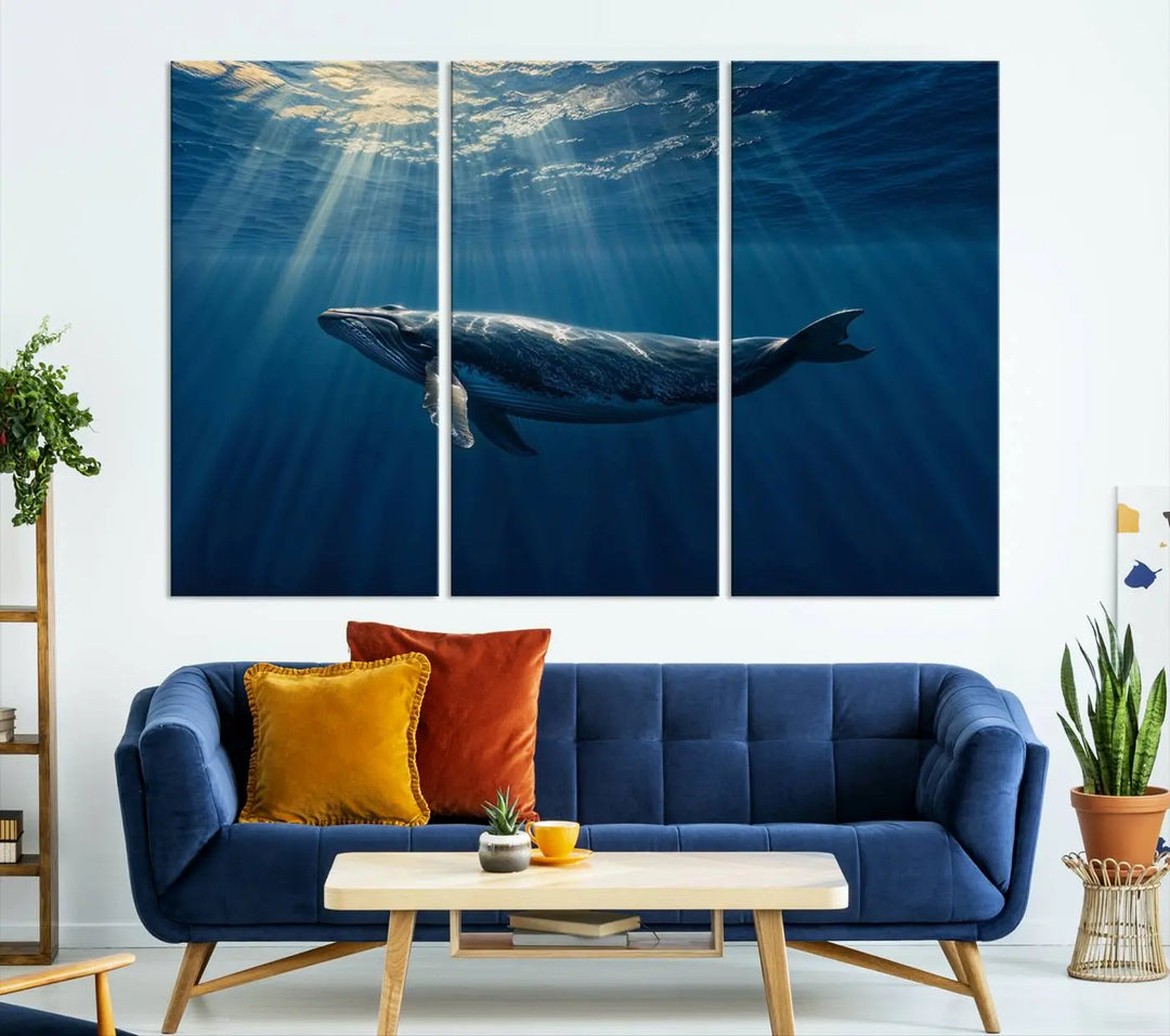 The Whale under Ocean Wall Art Canvas Print adorns the living room wall, capturing a sunlit ocean scene with a gallery-quality finish.