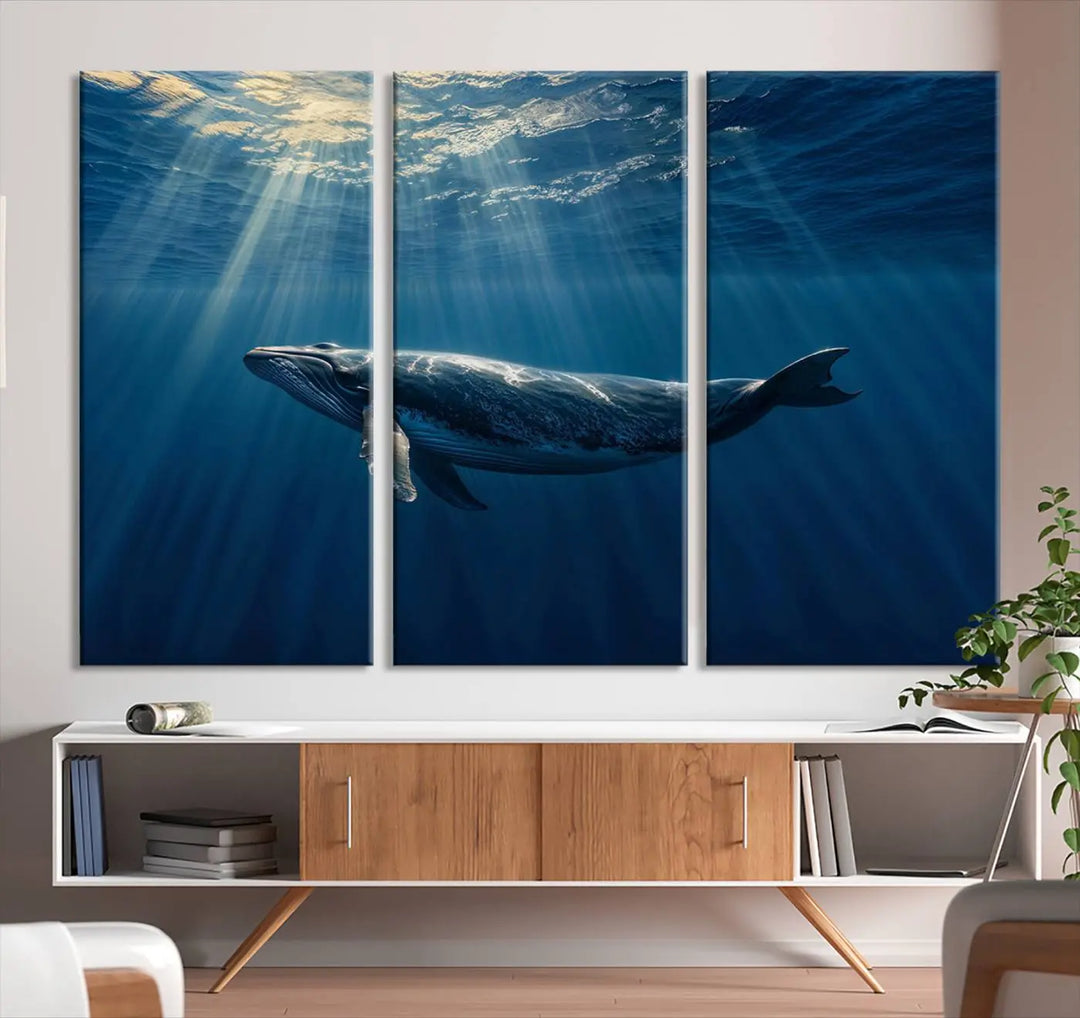 The Whale under Ocean Wall Art Canvas Print adorns the living room wall, capturing a sunlit ocean scene with a gallery-quality finish.