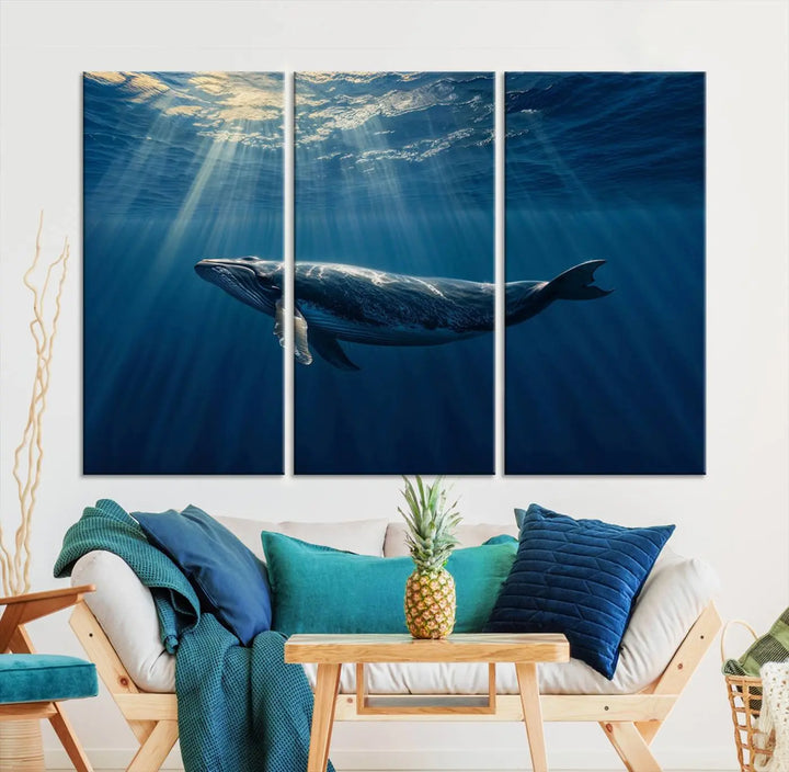 The Whale under Ocean Wall Art Canvas Print adorns the living room wall, capturing a sunlit ocean scene with a gallery-quality finish.