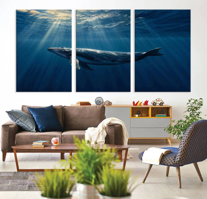 The Whale under Ocean Wall Art Canvas Print adorns the living room wall, capturing a sunlit ocean scene with a gallery-quality finish.