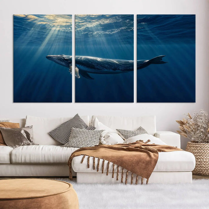 The Whale under Ocean Wall Art Canvas Print adorns the living room wall, capturing a sunlit ocean scene with a gallery-quality finish.