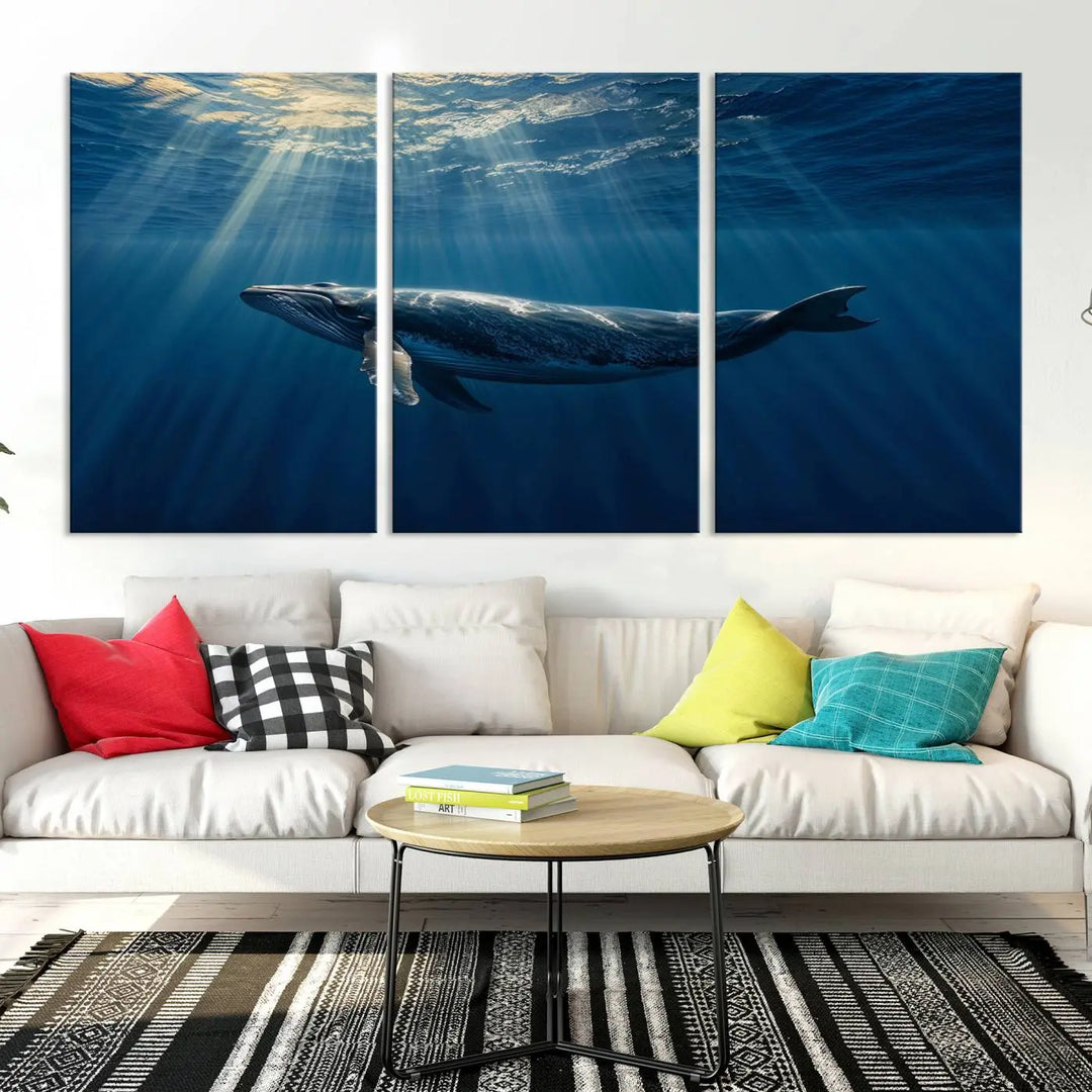 The Whale under Ocean Wall Art Canvas Print adorns the living room wall, capturing a sunlit ocean scene with a gallery-quality finish.