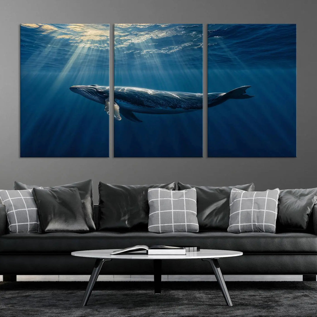 The Whale under Ocean Wall Art Canvas Print adorns the living room wall, capturing a sunlit ocean scene with a gallery-quality finish.