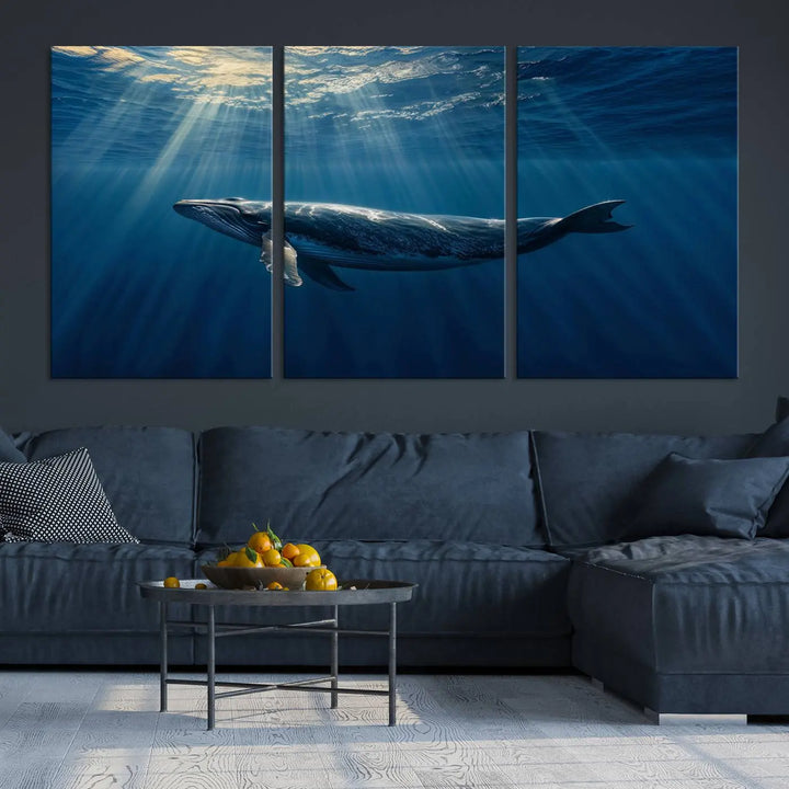 The Whale under Ocean Wall Art Canvas Print adorns the living room wall, capturing a sunlit ocean scene with a gallery-quality finish.