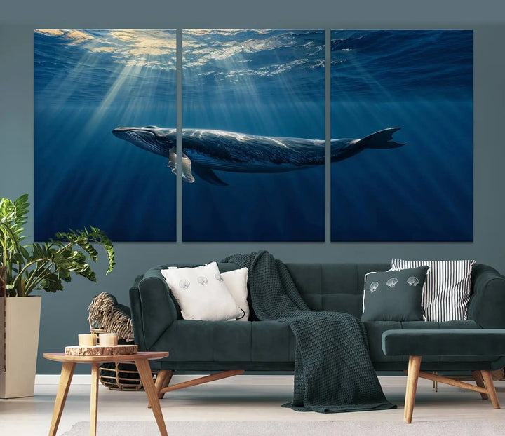 The Whale under Ocean Wall Art Canvas Print adorns the living room wall, capturing a sunlit ocean scene with a gallery-quality finish.