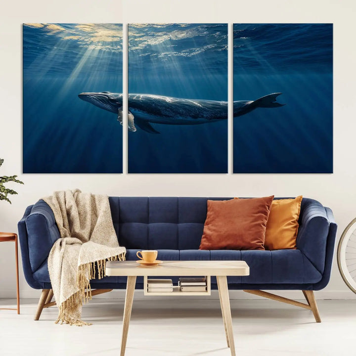 The Whale under Ocean Wall Art Canvas Print adorns the living room wall, capturing a sunlit ocean scene with a gallery-quality finish.