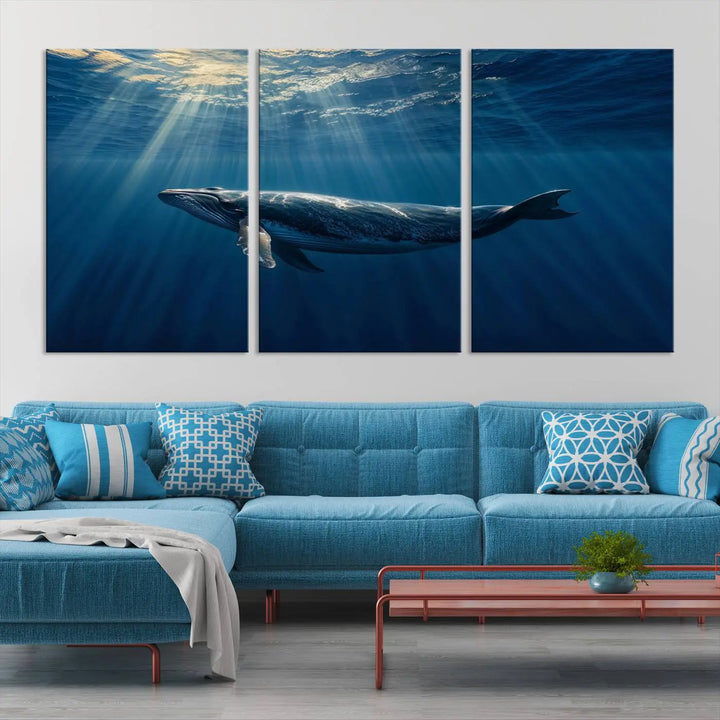 The Whale under Ocean Wall Art Canvas Print adorns the living room wall, capturing a sunlit ocean scene with a gallery-quality finish.