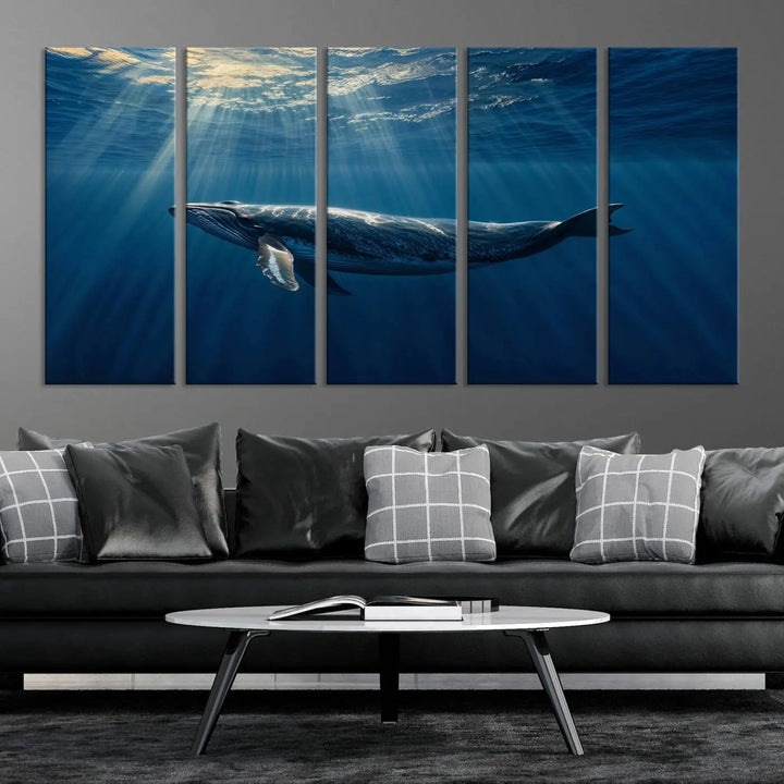 The Whale under Ocean Wall Art Canvas Print adorns the living room wall, capturing a sunlit ocean scene with a gallery-quality finish.