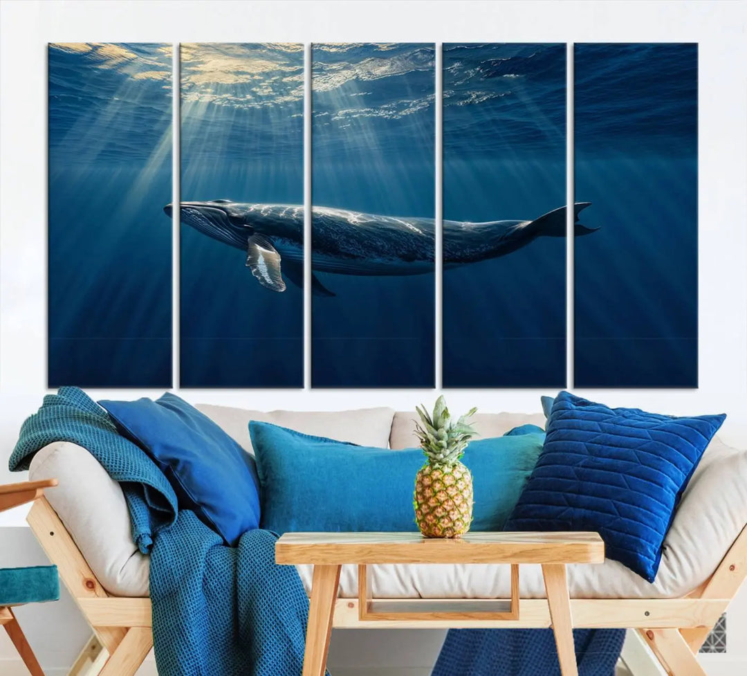 The Whale under Ocean Wall Art Canvas Print adorns the living room wall, capturing a sunlit ocean scene with a gallery-quality finish.