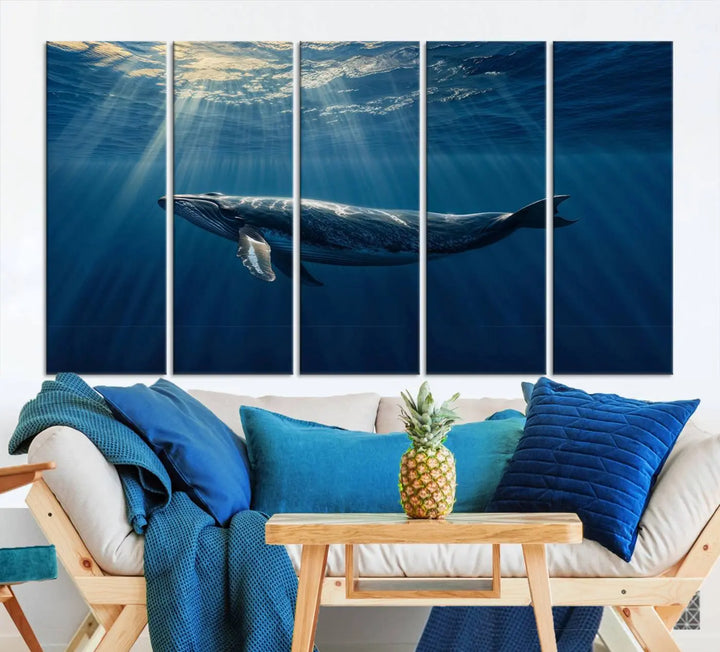 The Whale under Ocean Wall Art Canvas Print adorns the living room wall, capturing a sunlit ocean scene with a gallery-quality finish.