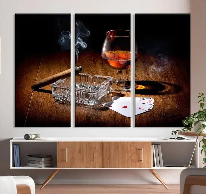 Product Named *Whiskey Cigar Wall Art Canvas Print Kitchen Wall*: Immerse yourself in triptych art depicting a cigar and smoke by an ashtray on a wooden table. This piece is crafted on museum-quality canvas and includes a UV-protective coating to maintain its vibrant appeal.