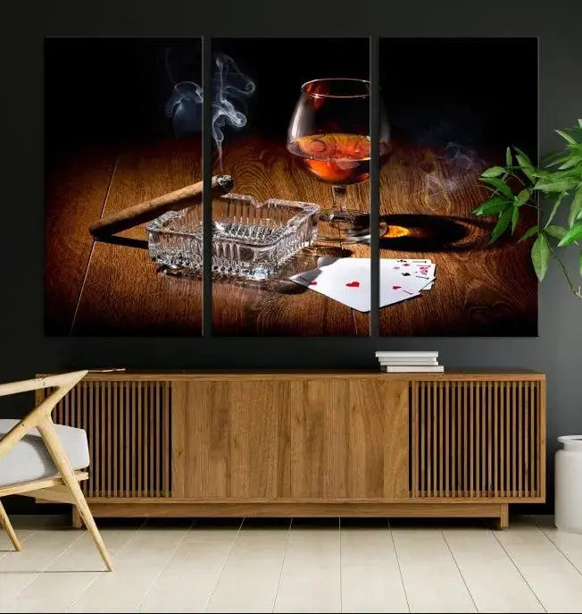 Product Named *Whiskey Cigar Wall Art Canvas Print Kitchen Wall*: Immerse yourself in triptych art depicting a cigar and smoke by an ashtray on a wooden table. This piece is crafted on museum-quality canvas and includes a UV-protective coating to maintain its vibrant appeal.