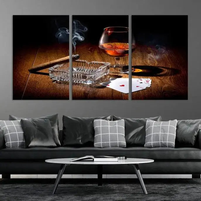 Product Named *Whiskey Cigar Wall Art Canvas Print Kitchen Wall*: Immerse yourself in triptych art depicting a cigar and smoke by an ashtray on a wooden table. This piece is crafted on museum-quality canvas and includes a UV-protective coating to maintain its vibrant appeal.