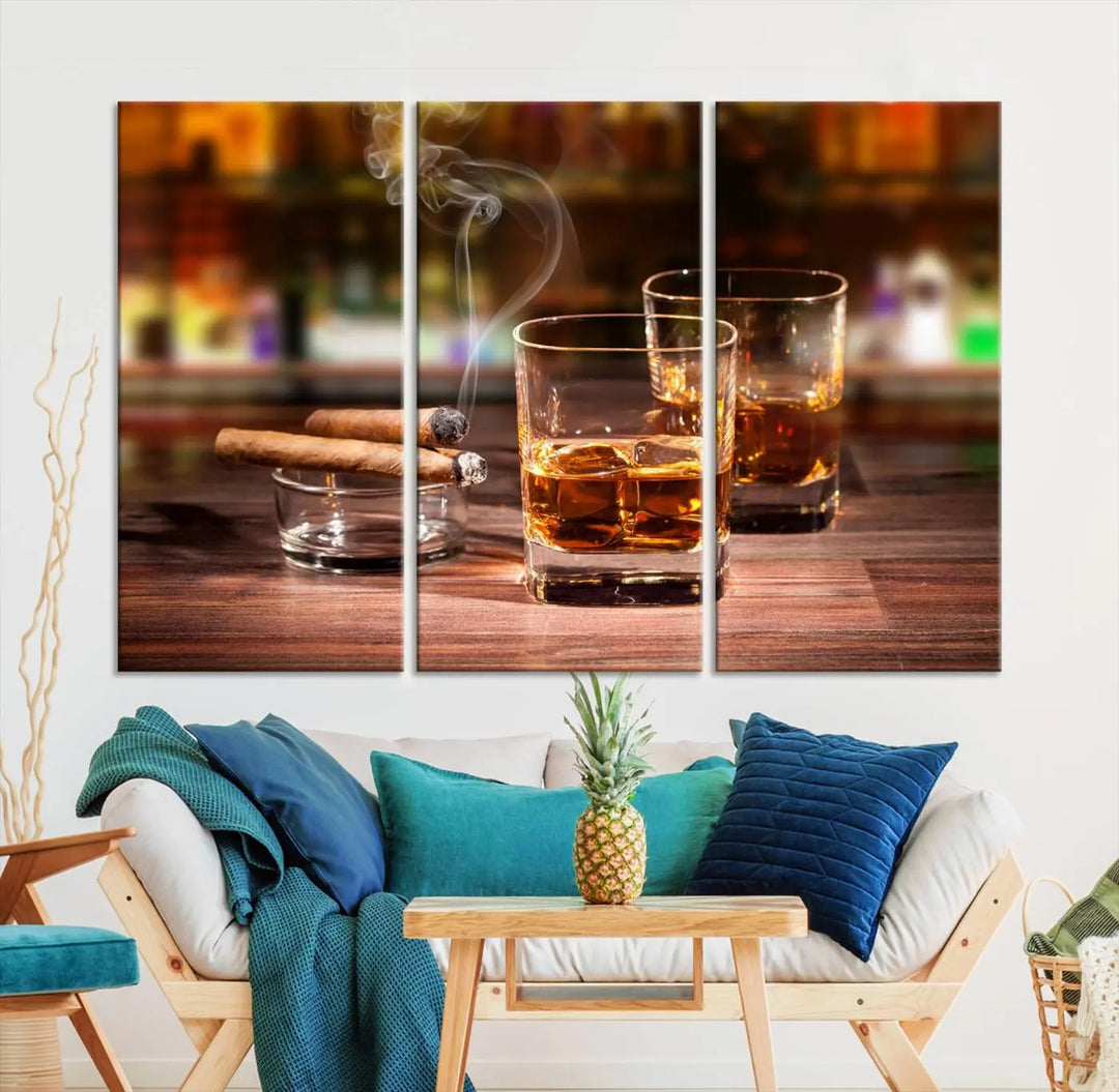 The Whiskey Cuban Cigars Canvas Print is a triptych wall art set that showcases two cigars and whiskey glasses on a wooden table. It is printed on museum-quality canvases with a UV-protective coating, designed for easy hanging.