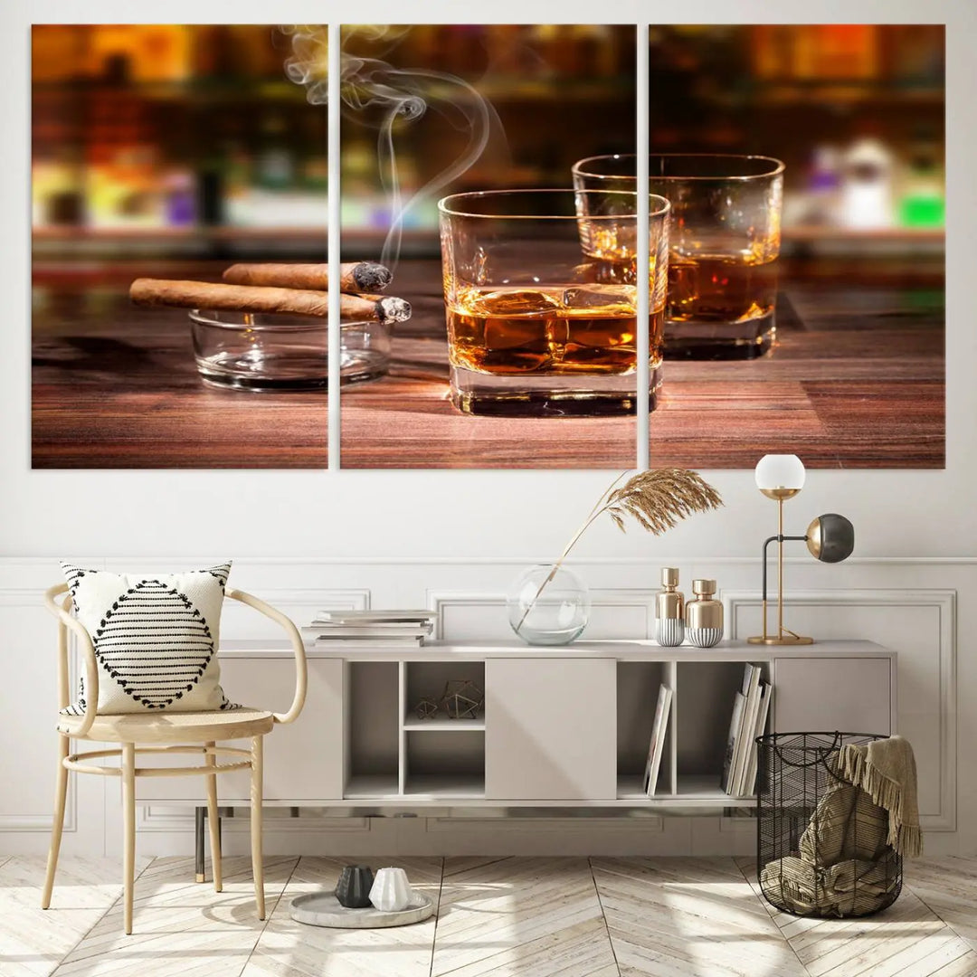 The Whiskey Cuban Cigars Canvas Print is a triptych wall art set that showcases two cigars and whiskey glasses on a wooden table. It is printed on museum-quality canvases with a UV-protective coating, designed for easy hanging.