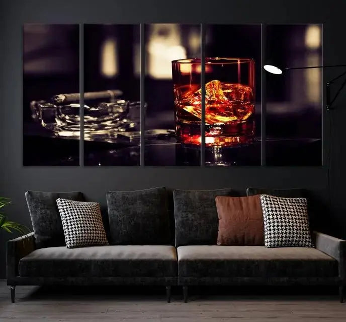 The Whiskey and Cigar Canvas, a luxurious triptych wall art for your living room or bar, portrays a whiskey glass and cigar on a table. This artwork beautifully captures the essence of opulent home decor.