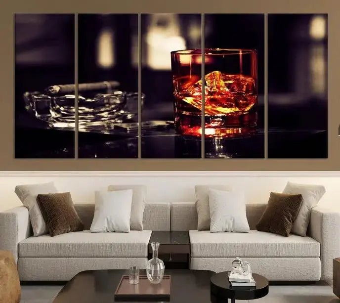 The Whiskey and Cigar Canvas, a luxurious triptych wall art for your living room or bar, portrays a whiskey glass and cigar on a table. This artwork beautifully captures the essence of opulent home decor.