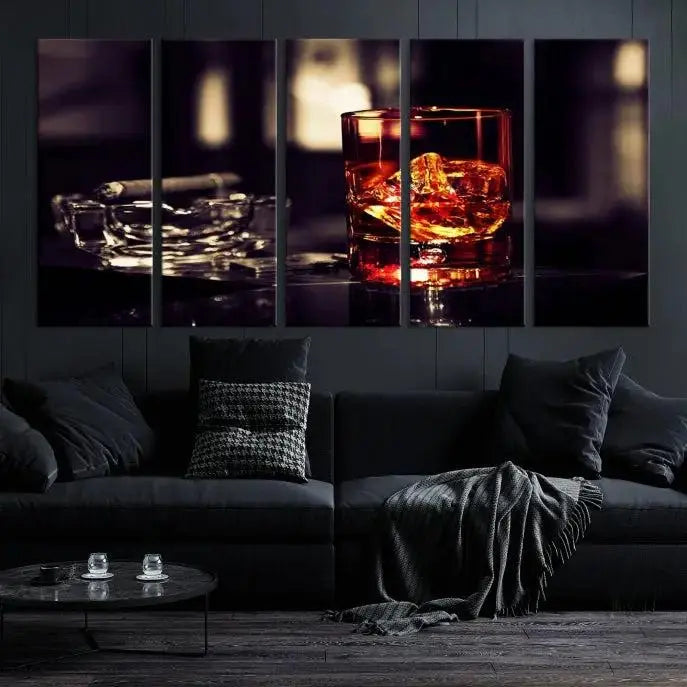 The Whiskey and Cigar Canvas, a luxurious triptych wall art for your living room or bar, portrays a whiskey glass and cigar on a table. This artwork beautifully captures the essence of opulent home decor.