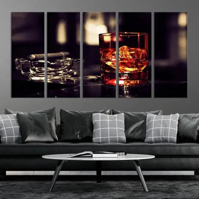 The Whiskey and Cigar Canvas, a luxurious triptych wall art for your living room or bar, portrays a whiskey glass and cigar on a table. This artwork beautifully captures the essence of opulent home decor.