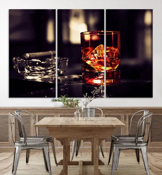 The Whiskey and Cigar Canvas, a luxurious triptych wall art for your living room or bar, portrays a whiskey glass and cigar on a table. This artwork beautifully captures the essence of opulent home decor.