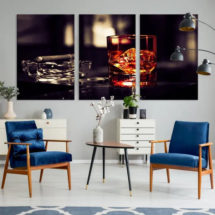 The Whiskey and Cigar Canvas, a luxurious triptych wall art for your living room or bar, portrays a whiskey glass and cigar on a table. This artwork beautifully captures the essence of opulent home decor.